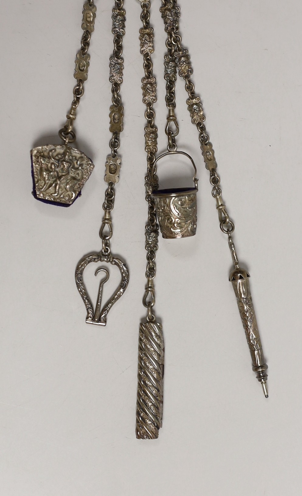 A Victorian white metal chatelaine with five accessories, import maker's mark for B.H. Joseph & Co, 32.7cm.